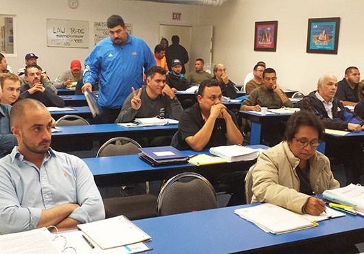 Students attend a law and business class at Contractors State License Schools in Van Nuys, California.